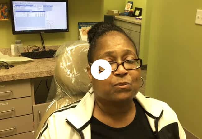 Video testimonial from a patient seated in a treatment chair at Gentle Touch Dentistry in Richardson, TX