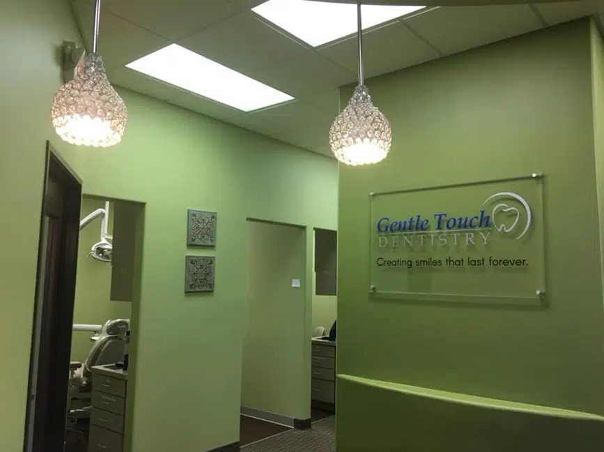 Hallway to treatment rooms with the Gentle Touch Dentistry sign at our Richardson, TX office